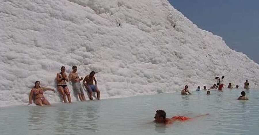 From Kusadasi: Daily Pamukkale - Hierapolis Tour - Walking through Hierapolis above the springs